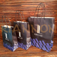 Bags with a twisted handle made of black craft paper